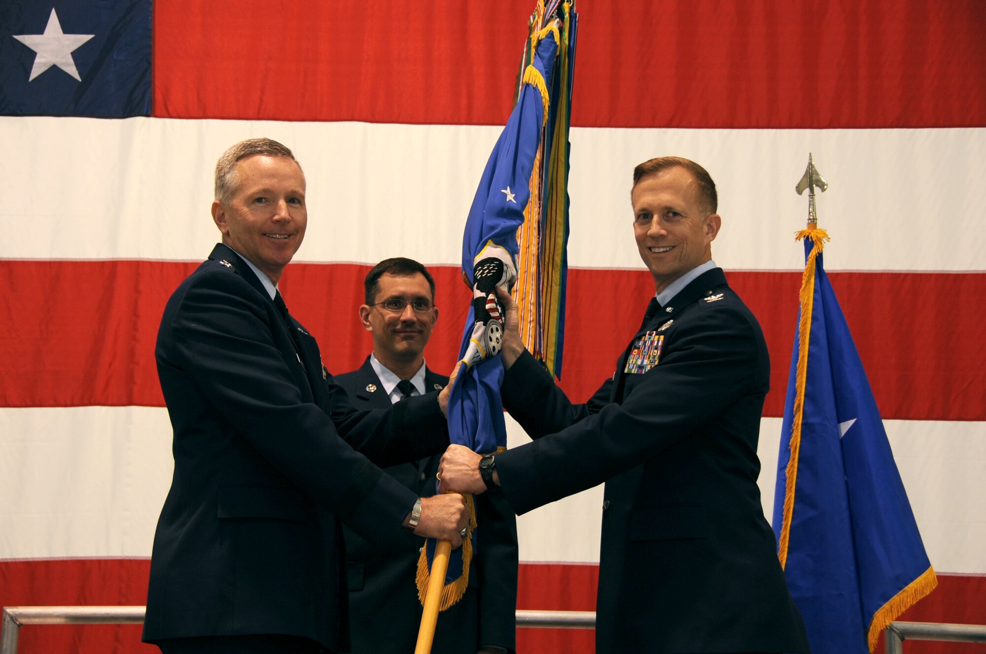 Col. Hubert Hegtvedt accepts the guidon from Maj. Gen. William Binger, 10th Air Force commander, during the 442nd Fighter Wing change of command ceremony, April 7, 2013. During the ceremony Col. Hubert Hegtvedt took command of the 442nd Fighter Wing from Brig. Gen. Eric Overturf. The 442nd FW is an A-10 Thunderbolt II Air Force Reserve unit at Whiteman Air Force Base, Mo. (U.S. Air force photo by Staff Sgt. Lauren Padden/Released)

