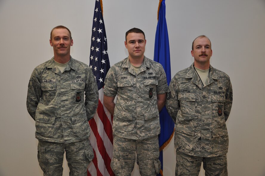 Staff Sgt. Dustin Miller, Senior Airman Zachariah Sierks, and Tech. Sgt. Matthew Croteau, 442nd Civil Engineers Squadron fire fighters, were recognized during a commander’s call, April 7, 2013, for their actions in saving a man's life. The 442nd CES is part of the 442nd Fighter Wing, an A-10 Thunderbolt II Air Force Reserve unit at Whiteman Air Force Base, Mo. (U.S. Air Force photo/Staff Sgt. Lauren Padden)