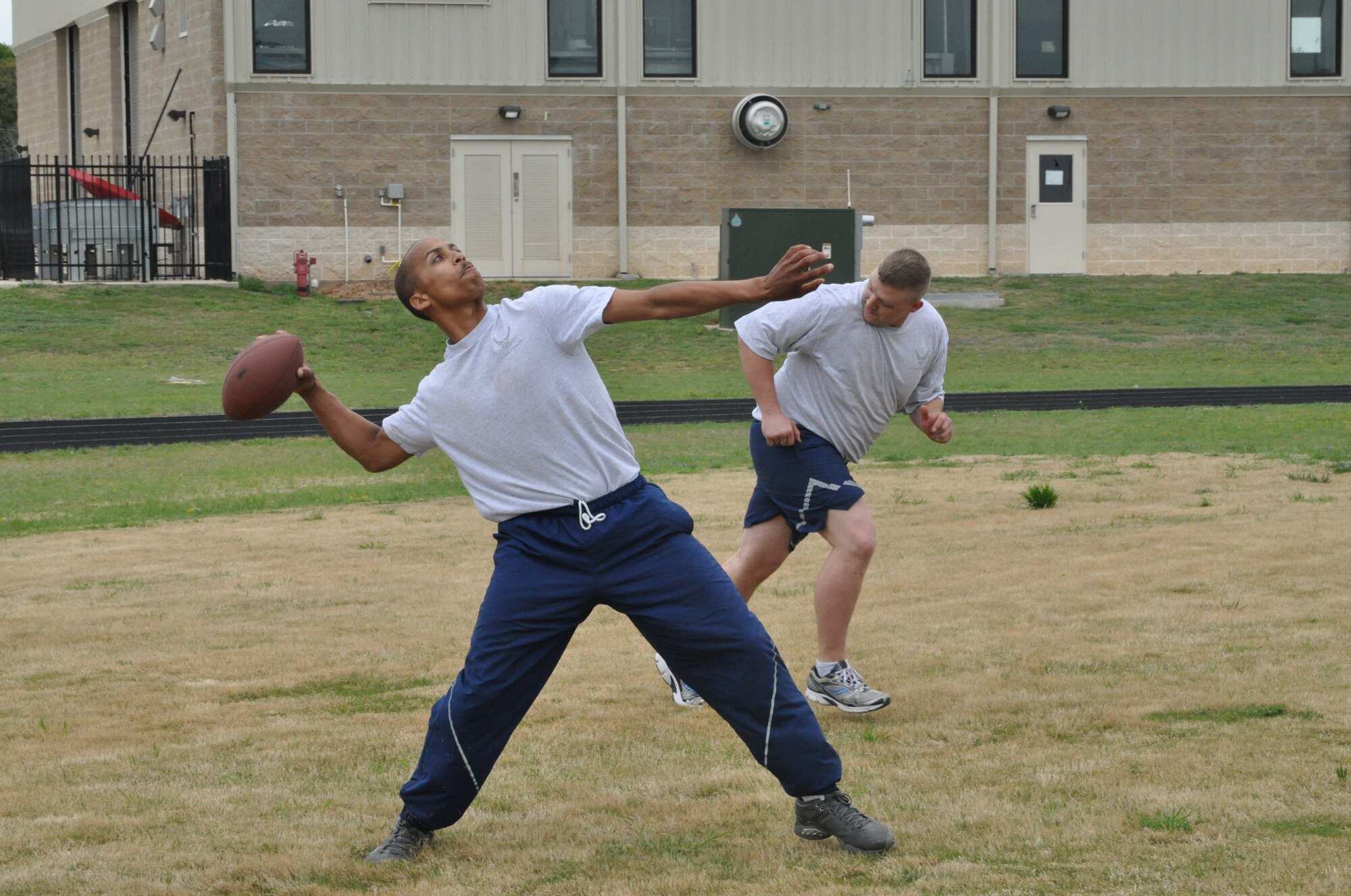 Airmen from the 301st Logistics Readiness Squadron play football at a squadron picnic to celebrate receiving the General Thomas P. Gerrity Logistics Award Sunday, April 7. The award recognizes the unit’s outstanding contributions to logistics operations. (U.S. Air Force photo by Senior Airman Melissa Harvey/Released)