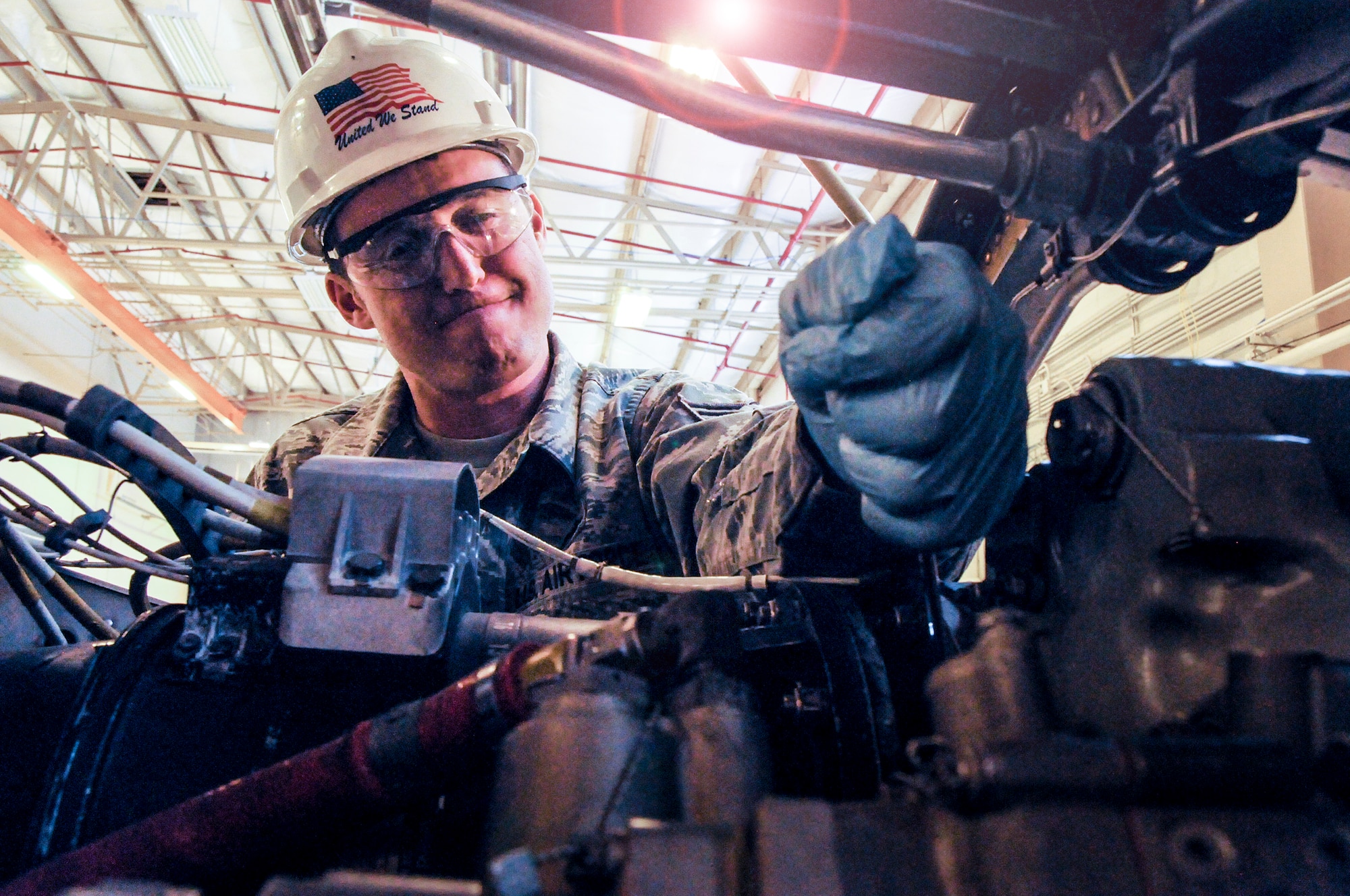 Staff Sgt. Tim Brunette, 911th Maintenance Squadron engine mechanic, tightens a bolt on a t56-15 C-130 Hercules engine at the propulsion shop, April 7, 2013. During an isochronal inspection the propulsion shop can complete a full turn-around on an engine in approximately one to three days, where it takes active duty propulsion shops approximately 10 to 12 days to complete the same amount of work. (U.S. Air Force photo by Senior Airman Joshua J. Seybert/Released)