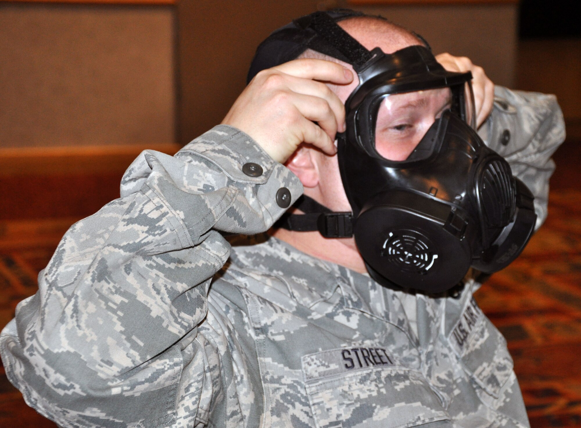 Tech. Sgt. Devin Street, a member of the 931st Maintenance Squadron, McConnell Air Force Base, Kan., practices donning his gas mask during the 931st Air Refueling Group's Ability to Survive and Operate (ATSO) Rodeo, April 7, 2013.  More than 100 members of the 931 ARG participated in the event.  (U.S. Air Force photo by 1st Lt. Zach Anderson)