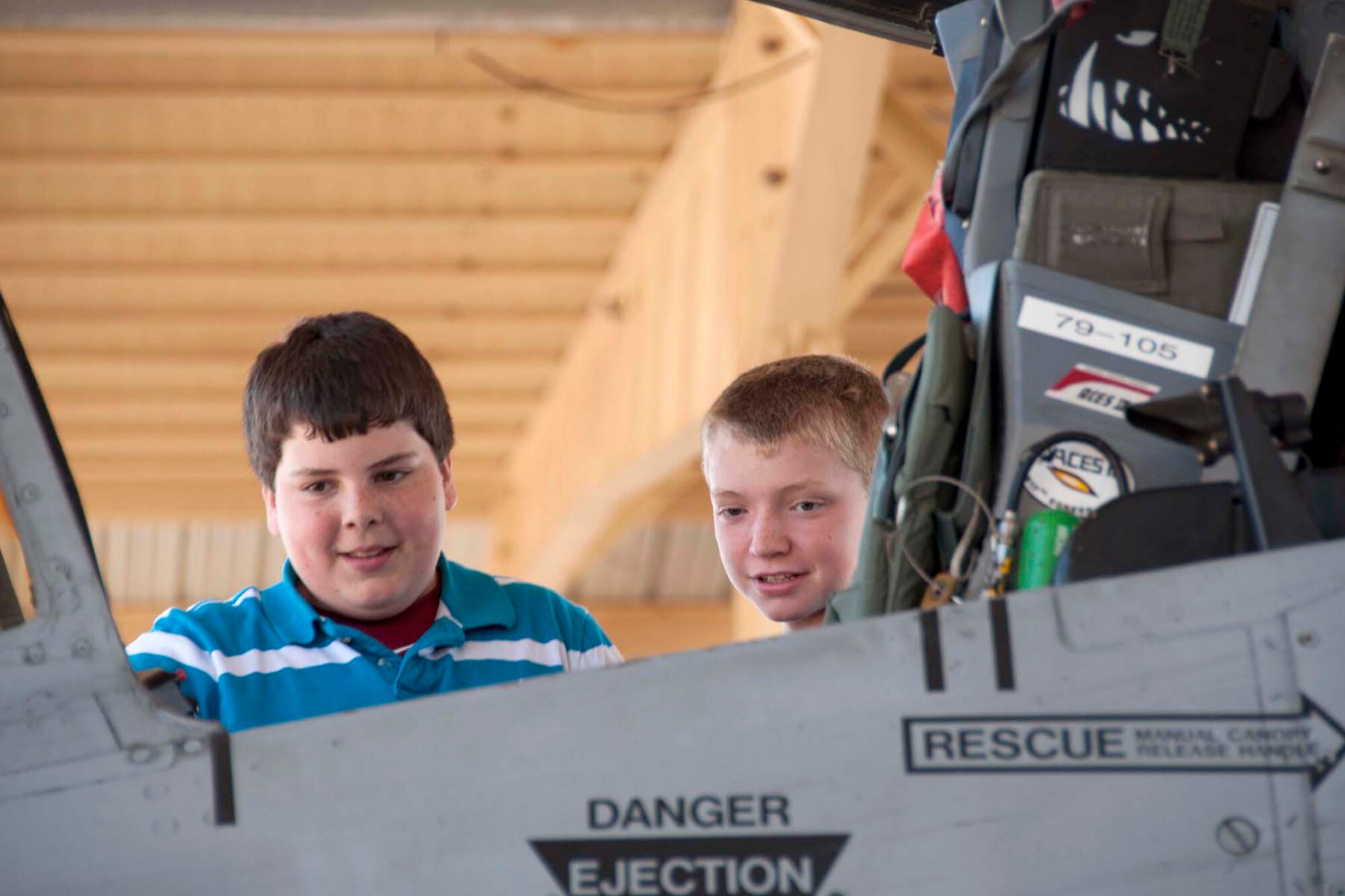 Sixth grade students from Trinity Christian School in Texarkana, Ark.  peer into the cockpit of an A-10 Thunderbolt II during a field study at Barksdale Air Force Base, La., April 5, 2013.   The students also toured the B-52 Stratofortress while on the base, climbing in the aircraft’s cockpit and viewing its bomb bay.   Students asked questions of, and heard talks from, briefers at each aircraft.    (U.S. Air Force photo by Tech.Sgt. Ted Daigle/Released) 