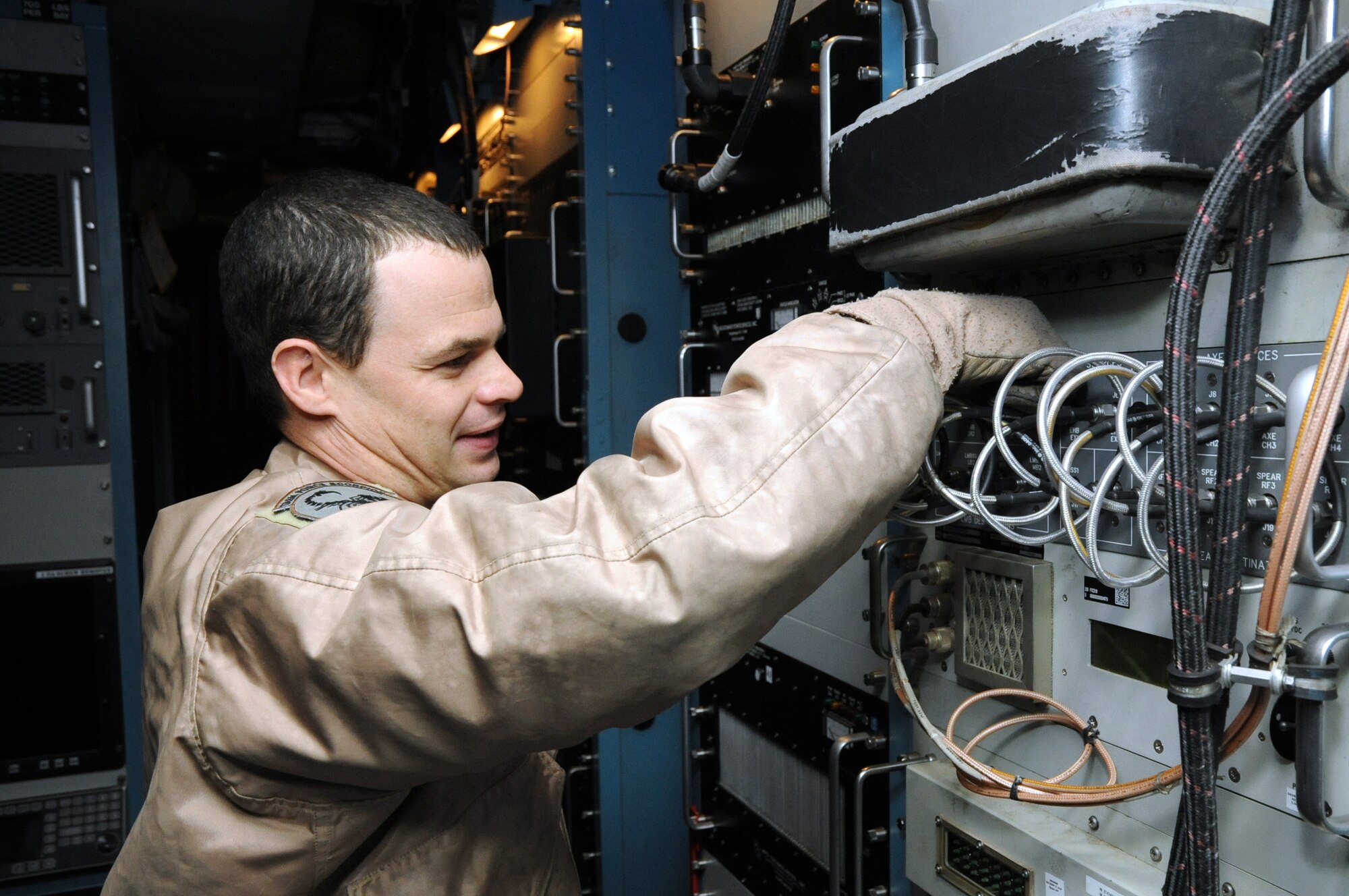 Tech. Sgt. Justin Longway, 41st Expeditionary Electronic Combat Squadron airborne maintenance technician, checks a patch panel aboard an EC-130 Compass Call aircraft on Bagram Airfield, Afghanistan, March 23, 2013. The 41st EECS flies nightly missions in support of troops on the ground. (U.S. Air Force photo/Staff Sgt. David Dobrydney)