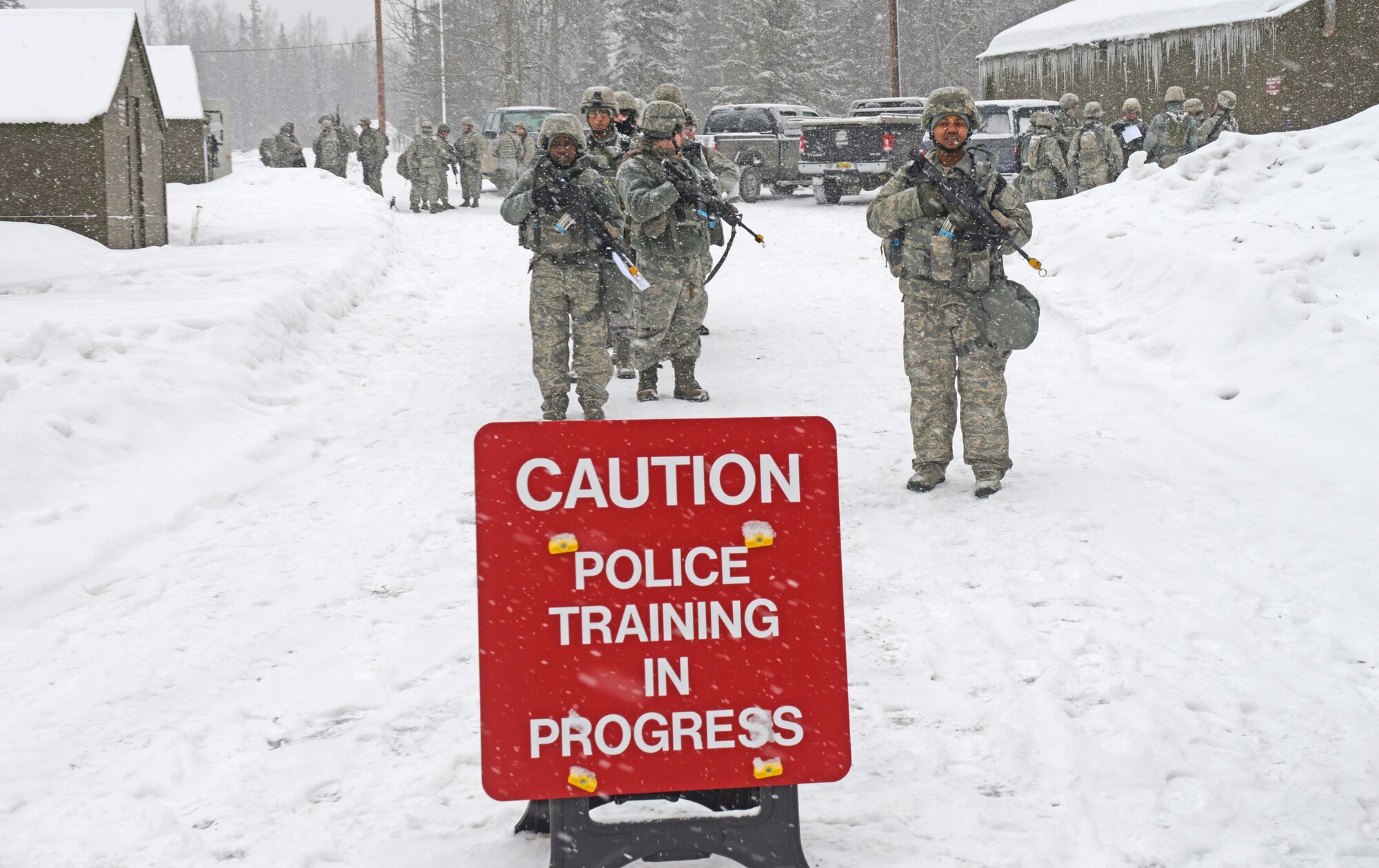 Combined units of Air Force active duty, guard and reserve service members conduct Phase II reconnaissance at Camp Mad Bull, April 6 on Joint Base Elmendorf-Richardson. Phase II of the Polar Force exercise simulates deployment scenarios to familiarize service members on proper operating procedures. (U.S. Air Force photo/Airman Ty-Rico Lea)