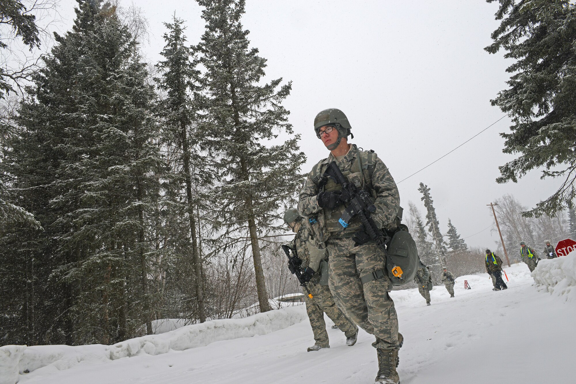 Combined units of Air Force active duty, guard and reserve service members conduct Phase II reconnaissance at Camp Mad Bull, April 6 on Joint Base Elmendorf-Richardson. Phase II of the Polar Force exercise simulates deployment scenarios to familiarize service members on proper operating procedures. (U.S. Air Force photo/Airman Ty-Rico Lea)