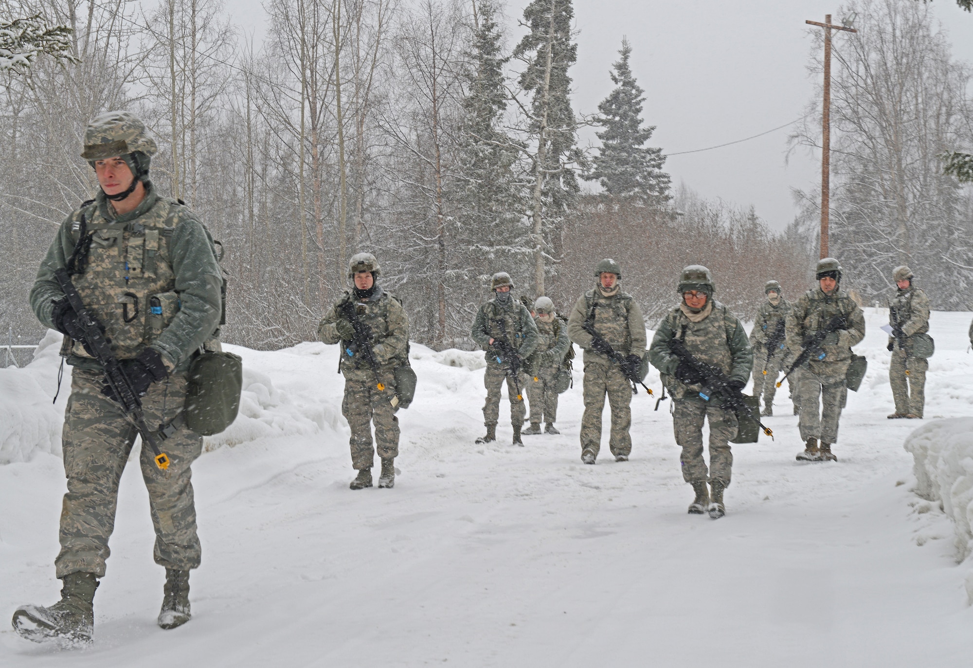Combined units of Air Force active duty, guard and reserve service members conduct Phase II reconnaissance at Camp Mad Bull, April 6 on Joint Base Elmendorf-Richardson. Phase II of the Polar Force exercise simulates deployment scenarios to familiarize service members on proper operating procedures. (U.S. Air Force photo/Airman Ty-Rico Lea)