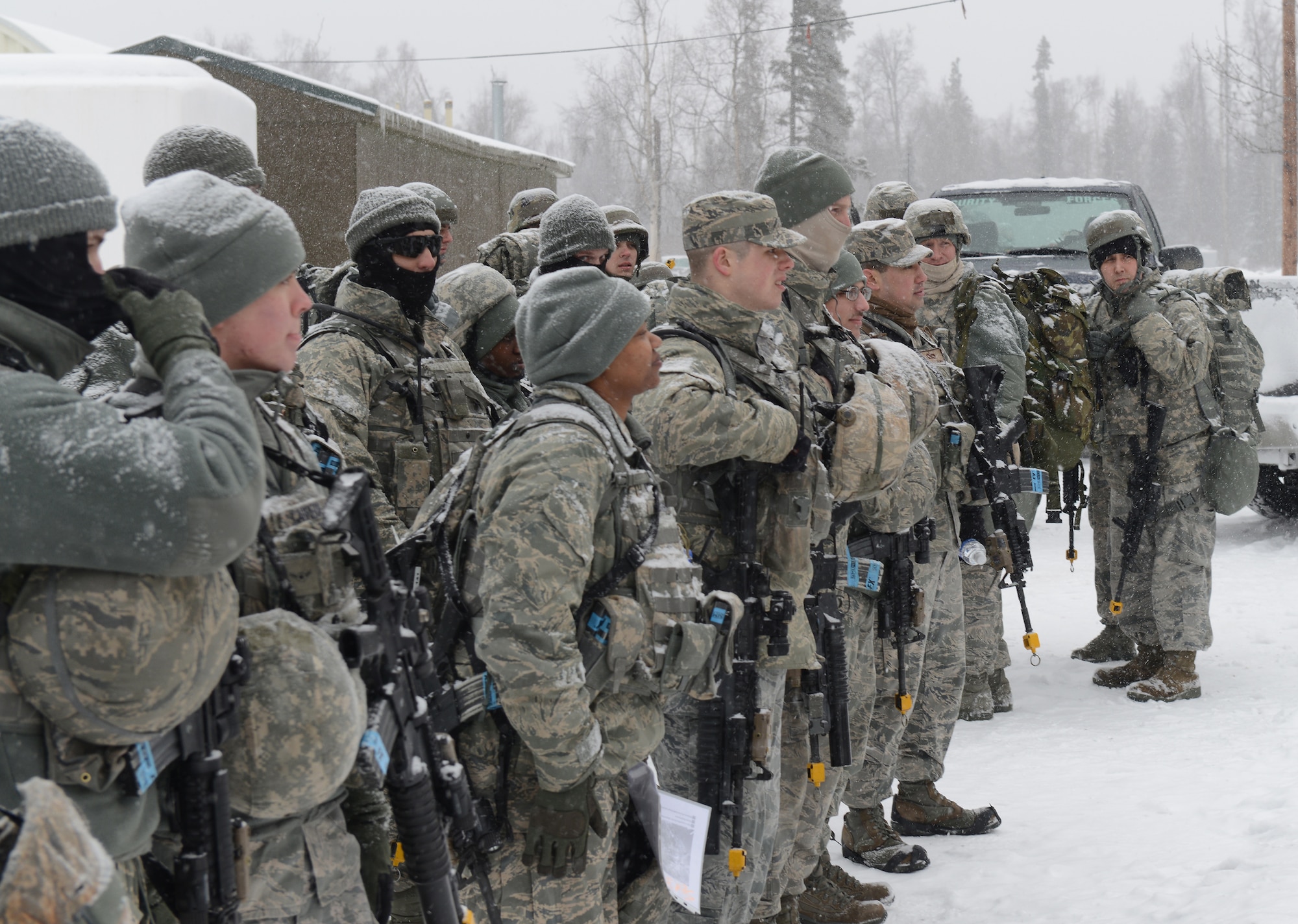 Combined units of Air Force active duty, guard and reserve service members conduct Phase II reconnaissance at Camp Mad Bull, April 6 on Joint Base Elmendorf-Richardson. Phase II of the Polar Force exercise simulates deployment scenarios to familiarize service members on proper operating procedures. (U.S. Air Force photo/Airman Ty-Rico Lea)
