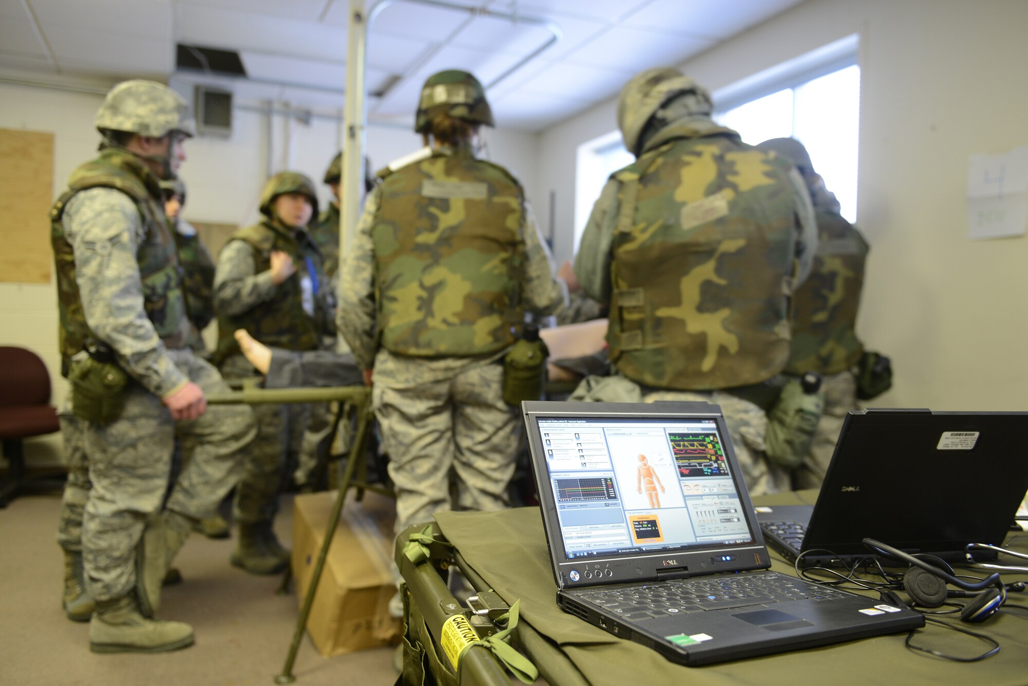 673d Medical Support Group Air Force service members perform an emergency operation on an animated mannequin during Phase II of the Polar Force 13-3 exercise, April 6 on Joint Base Elmendorf-Ricahrdson. Phase II of the Polar Force exercise simulates deployment scenarios to familiarize service members on proper operating procedures. (U.S. Air Force photo/Airman Ty-Rico Lea)