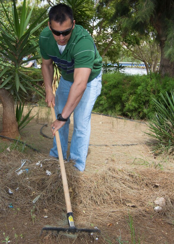 Sgt. Sean Varela, a Ocoee, Fla., native, and radio supervisor assigned to Battalion Landing Team 3/2, 26th Marine Expeditionary Unit (MEU), rakes debris while volunteering at the Theotokos Foundation in Limassol, Cyprus, April 4, 2013. The 26th MEU is deployed to the 6th Fleet area of operation. The MEU operates continuously across the globe, providing the president and unified combatant commanders with a forward-deployed, sea-based, quick-reaction force. The MEU is a Marine Air-Ground Task Force capable of conducting amphibious operations, crisis-response and limited contingency operations. (U.S. Marine Corps photo by Cpl. Kyle N. Runnels/Released)