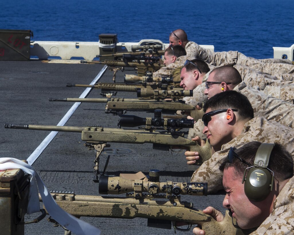 U.S. Marines assigned to Scout Sniper Platoon, Weapons Company, Battalion Landing Team (BLT) 3/2, 26th Marine Expeditionary Unit (MEU), conduct a battlesight zero exercise on the flight deck of the USS Kearsarge (LHD 3), at sea, April 7, 2013. The 26th MEU is deployed to the 5th Fleet area of operations aboard the Kearsarge Amphibious Ready Group. The 26th MEU operates continuously across the globe, providing the president and unified combatant commanders with a forward-deployed, sea-based quick reaction force. The MEU is a Marine Air-Ground Task Force capable of conducting amphibious operations, crisis response and limited contingency operations.  (U.S. Marine Corps photo by Lance Cpl. Juanenrique Owings/Released)