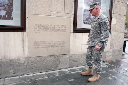 LTG H Steven Blum, the chief of the National Guard Bureau, on April 10, 2008, pauses to reflect at the Sarajevo street corner where on June 28, 1914, Gavrilo Princip assassinated the heir to the Austro-Hungarian throne, the Archduke Franz Ferdinand, considered the event that precipitated World War I, resulting in about 20 million deaths. In the aftermath of the death of Marshall (Josip Broz) Tito and the collapse of the former Yugoslavia, the Balkans were again plunged into violence in the 1990s that was ended by NATO intervention. The National Guard has contributed to the Balkan peace enforcement mission for nearly a decade and in Sarajevo military leaders of Bosnia and Herzegovina say they would like to use the National Guard as one of the models for their armed forces.