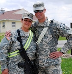 Army National Guard Spc. Roschell Eaton and her son, Spc. Jason Hutchins, both from 3175th Military Police Company, train at Camp Atterbury, Ind., for their upcoming deployment as part of Kosovo Force 10, Multinational Task Force East.
