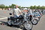 Army Guard Sgt. 1st Class James Hockett poses with his 2006 Harley Davidson Night Train at the 2008 National Capital Region Joint Services Motorcycle Safety Event at the Pentagon May 1.