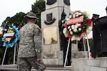 Army Lt. Col. George Kranske, commander of 2nd Battalion, 156th Infantry Regiment of the Lousiana Army National Guard steps up to honor the fallen Soldiers of his battalion as well as those of the Royal Thai Army during a memorial wreath laying ceremony held during the 2008 Cobra Gold exercise held in May.