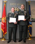Sgt. 1st Class John Craig, left, with Maj. David Guido in the Joint Staff Flag Room at the Pentagon on May 16, 2008, after LTG H Steven Blum, the chief of the National Guard Bureau, presented Craig with the Joint Services Achievement Medal and Guido with the Defense Meritorious Service Medal. It was the first joint award ceremony since the National Guard Bureau became a joint activity of the Department of Defense when President George W. Bush signed the National Defense Authorization Act for Fiscal Year 2008 on Jan. 28, 2008.