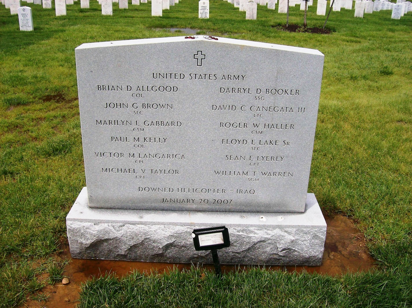 A mass grave marker at Arlington National Cemetery honors the 12 soldiers killed when their UH-60 Black Hawk helicopter was shot down near Baghdad on Jan. 20, 2007.