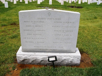 A mass grave marker at Arlington National Cemetery honors the 12 soldiers killed when their UH-60 Black Hawk helicopter was shot down near Baghdad on Jan. 20, 2007.