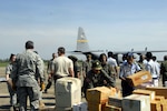 The airfield at Chhnang Province, Cambodia, is busy with activity as Royal Cambodian Armed Forces, Alaska National Guard and U.S. Air Force members get operations underway for Pacific Angel 2008 here May 24. Operation Pacific Angel is a joint/combined humanitarian assistance operation.