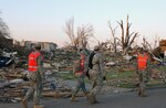 Iowa National Guard Soldiers patrol the streets of Parkersburg May 28, three days after a tornado ravaged the town, destroying homes and businesses and decimating infrastructure. Among several units called up, approximately 160 Soldiers from the 1st Battalion, 133rd Infantry are providing security and aiding local officials in recovery efforts. Other Iowa National Guard units are providing communications support, transporting water, creating emergency electrical power and providing operational support.