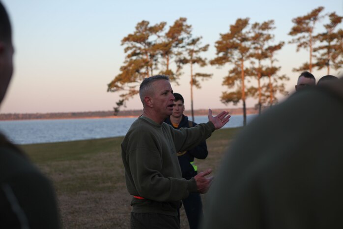 Sgt. Maj. George W. Young Jr., the top Marine enlisted advisor for 2nd Marine Logistics Group, talks with servicemembers during his weekly physical training session aboard Camp Lejeune, N.C., March 28, 2013. Young started the “Pain Train” as a way to talk to younger servicemembers and improve fitness scores. (U.S. Marine Corps photo by Lance Cpl. Shawn Valosin)