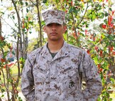 Lance Cpl. Eddy. D. Tineomateo, an administrative specialist with Headquarters Company, Combat Logistics Regiment 27, 2nd Marine Logistics Group, poses for a photo aboard Camp Lejeune, N.C., April 8, 2013. Tineomateo participated in a weekly workout session with the group’s sergeant major and plans to attend every week. (U.S. Marine Corps photo by Lance Cpl. Shawn Valosin)