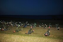 Servicemembers conduct flutter kicks during a physical training session led by Sgt. Maj. George W. Young Jr., 2nd Marine Logistics Group’s top Marine enlisted advisor, aboard Camp Lejeune, N.C., March 28, 2013. Young holds weekly physical training sessions in an effort to improve the overall fitness levels of servicemembers, and to get an opportunity to speak with them. (U.S. Marine Corps photo by Lance Cpl. Shawn Valosin)