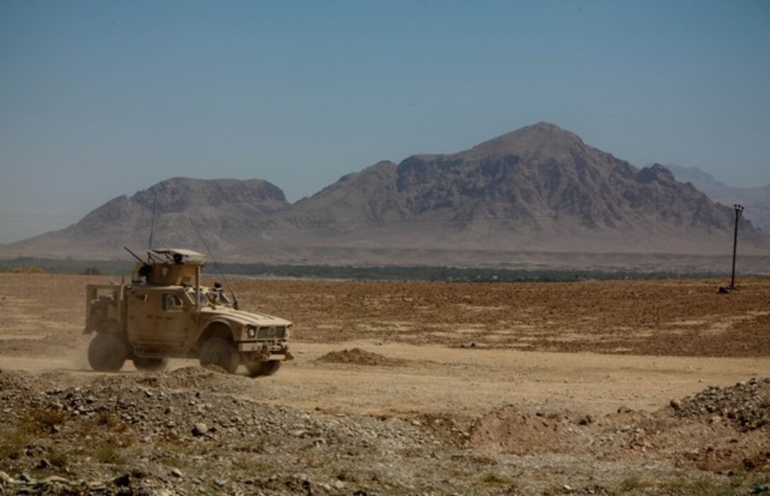 A mine resistant ambush protected all-terrain vehicle, or M-ATV, travels on a dirt road near Patrol Base Mehrai, Afghanistan in July 2011. Marine Corps Systems Command is considering a technology initiative that would allow Marines to use voice commands to operate C2 software applications and equipment virtually “hands free” when traveling in tactical military vehicles over rugged terrain. 