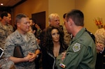 Country music singer Laura Bryna, center, talks with Col. Joe Lengyel, right, commander of the Air National Guard Readiness Center, during an appearance at the Crowne Plaza Hotel in Arlington, Va., Friday, May 30, 2008. Bryna is part of the Air National Guard's new recruiting campaign which features a song by Bryna entitled "Hometown Hereos."