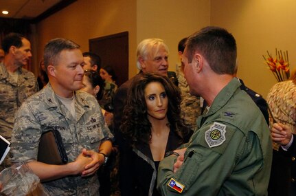 Country music singer Laura Bryna, center, talks with Col. Joe Lengyel, right, commander of the Air National Guard Readiness Center, during an appearance at the Crowne Plaza Hotel in Arlington, Va., Friday, May 30, 2008. Bryna is part of the Air National Guard's new recruiting campaign which features a song by Bryna entitled "Hometown Hereos."