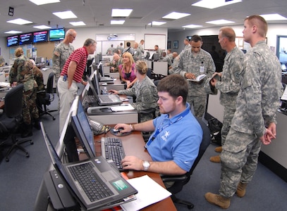 Personnel prepare for emergency response requests during the "Hurricane Herb" scenario at the Florida National Guard's Joint Operations Center in St. Augustine, Fla., June 2.