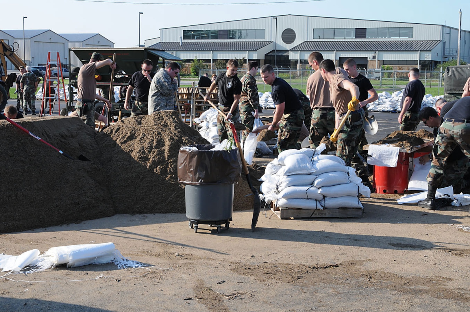 181 Intelligence Wing, Terre Haute, Ind., continuously fill sand bags in relief following the flood waters that hit early Saturday morning.