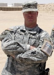 Sgt. 1st Class Vaughn R. Larson, a syndicated editorial cartoonist.