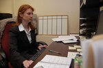 Wyoming Army National Guard Staff Sgt. Jessica Williams, works at her desk at the Cheyenne Police Department in her role as a National Guard Counterdrug Program intelligence analyst, specializing in gang activity, on June 16, 2008.