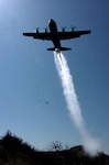 A C-130 Hercules cargo plane assigned to the 145th Airlift Wing, North Carolina Air National Guard, drops 3,000 gallons of water over the Los Padres National Forest, Calif., May 7 using a modular airborne fire fighting system (MAFFS) during the MAFFS 2008 Annual Certifying Event. The training event included all aircrew, maintenance and support personnel directly supporting the MAFFS mission. There are four Air National Guard and Air Force Reserve units involved with MAFFS: 145th Airlift Wing, (Charlotte), 146th Airlift Wing (Channel Islands), 153rd Airlift Wing, (Wyoming) and the 302nd Airlift Wing (Colorado).