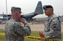 LTG H Steven Blum, chief of the National Guard Bureau, overlooks the wildfire response operations of two North Carolina National Guard C-130 Hercules aircraft from the 145th Airlift Wing with Maj. Gen. William Wade, adjutant general of California, on the airfield at Chico, Calif., on June 26, 2008.