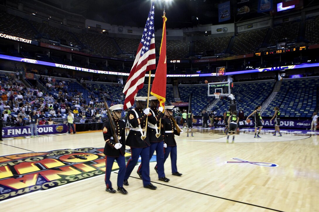 The Marine Corps color guard opened the 2013 All-American high school game at New Orleans Arena here, April 6, as a part of the Women Basketball Coaches Association Conference. Staff Sgt. Tyrone Hendrickson lead Sgts.  Jerry West, Josue Castillo, and Colbert Jackson on the team from Marine Corps Recruiting Station, Baton Rouge.