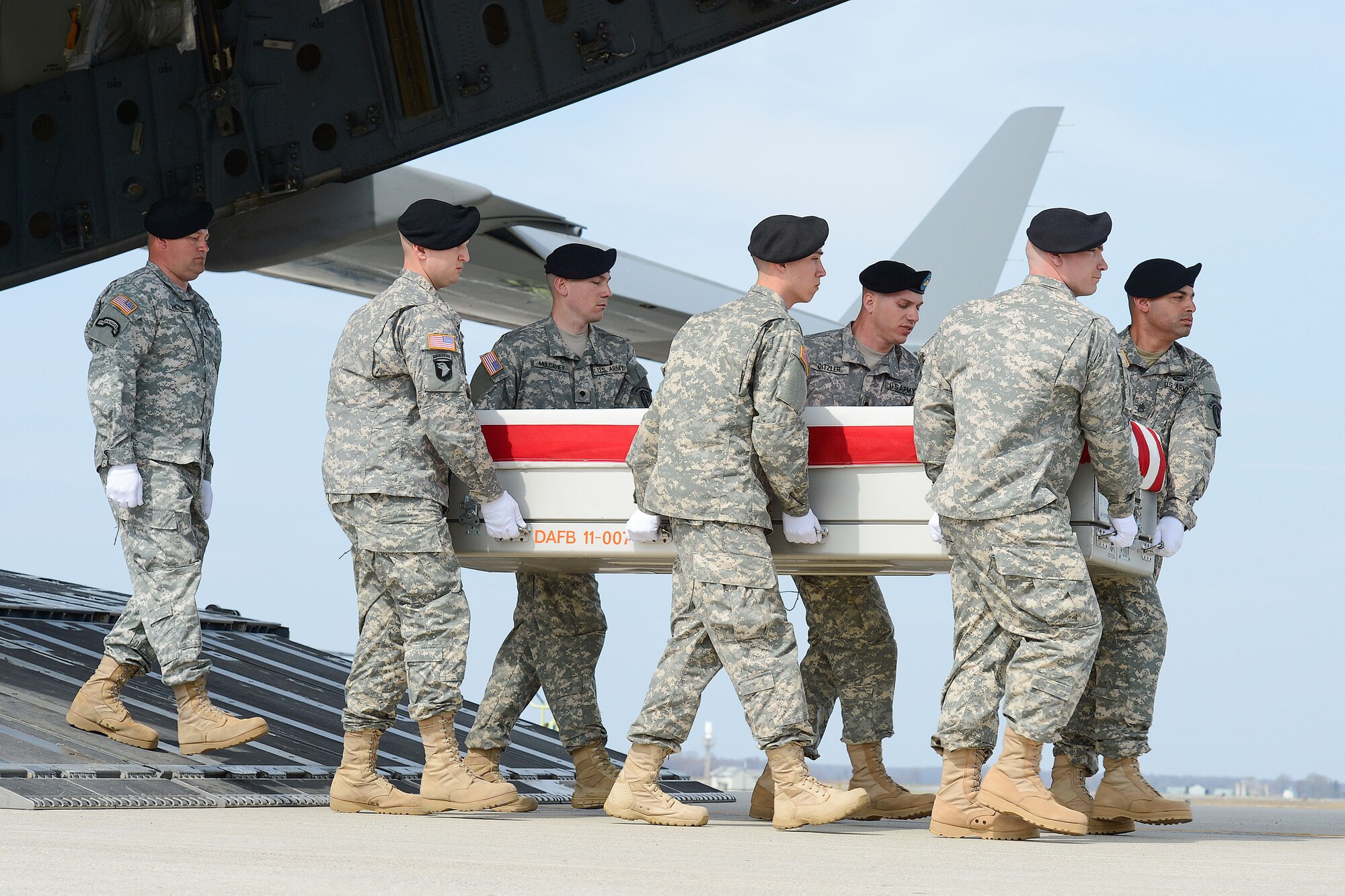 A U.S. Army carry team transfers the remains of Department of the Army civilian Hyun K. Shin during a dignified transfer April 8, 2013 at Dover Air Force Base, Del. (U.S. Air Force photo/Greg L. Davis)