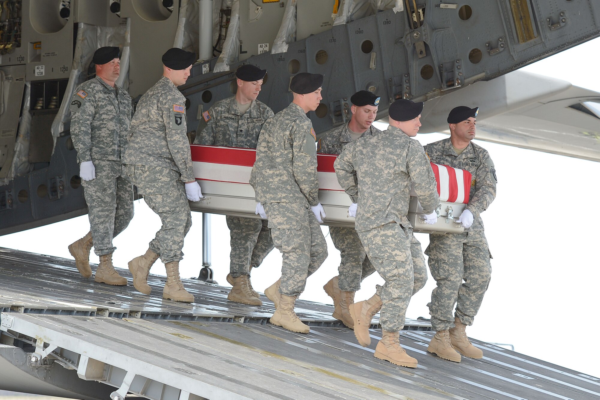 A U.S. Army carry team transfers the remains of Staff Sgt. Christopher M. Ward of Oak Ridge, Tenn., during a dignified transfer April 8, 2013, at Dover Air Force Base, Del. Ward was assigned to Troop A, 5th Squadron, 7th Cavalry, 1st Brigade Combat Team, Ft. Stewart, Ga. (U.S. Air Force photo/Greg L. Davis)