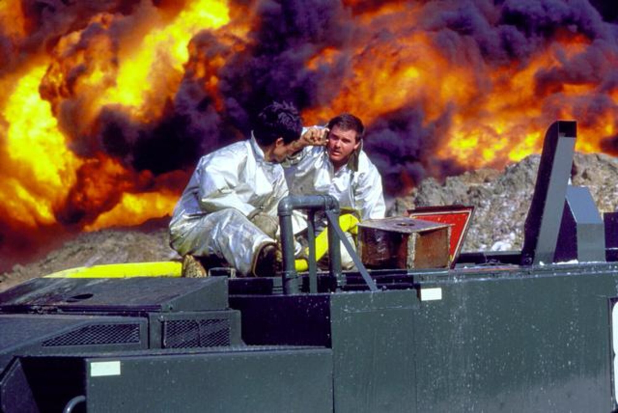 Firefighters with the 51st Civil Engineer Squadron battle a fuel fire after an explosion on Hill 170 at Osan Air Base, Republic of Korea April 5, 1986. It took teams almost 18 hours to put the fire out. (Courtesy photo)