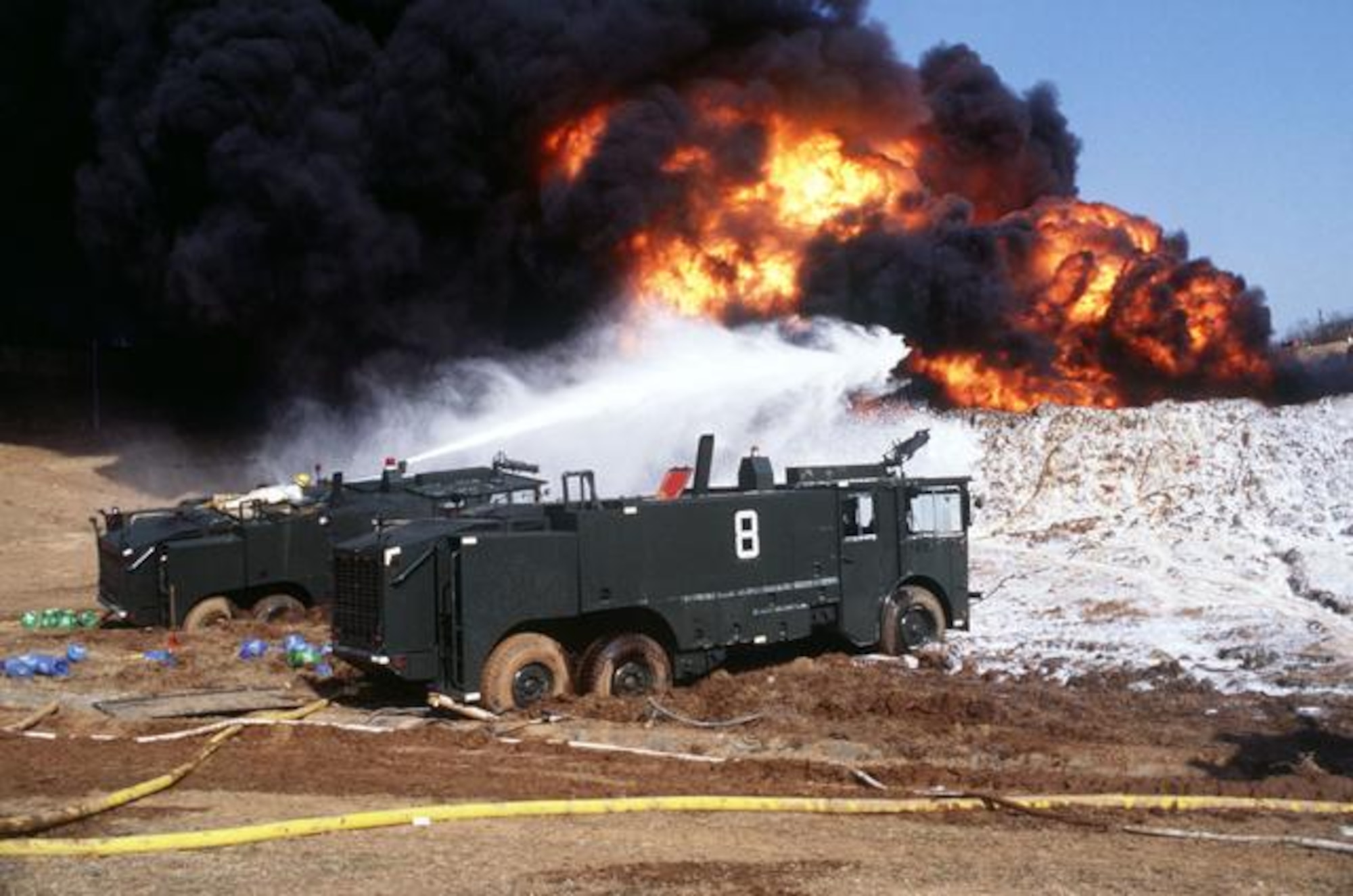 Firefighters with the 51st Civil Engineer Squadron battle a fuel fire after an explosion on Hill 170 at Osan Air Base, Republic of Korea April 5, 1986. It took teams almost 18 hours to put the fire out. (Courtesy photo)