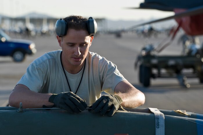 Staff Sgt. Michael Briston, 57th Aircraft Maintenance Squadron aircraft armament systems technician, inspects a guided bomb unit during a quarterly load crew competition April 5, 2013, at Nellis Air Force Base, Nev.  The weapons load crew competition tests the skills of Airmen from Viper, Thunder, Raptor, Falcon, Eagle, Tomahawk, Lightning and Strike Aircraft Maintenance Units. (U.S. Air Force Photo by Airman 1st Class Jason Couillard)