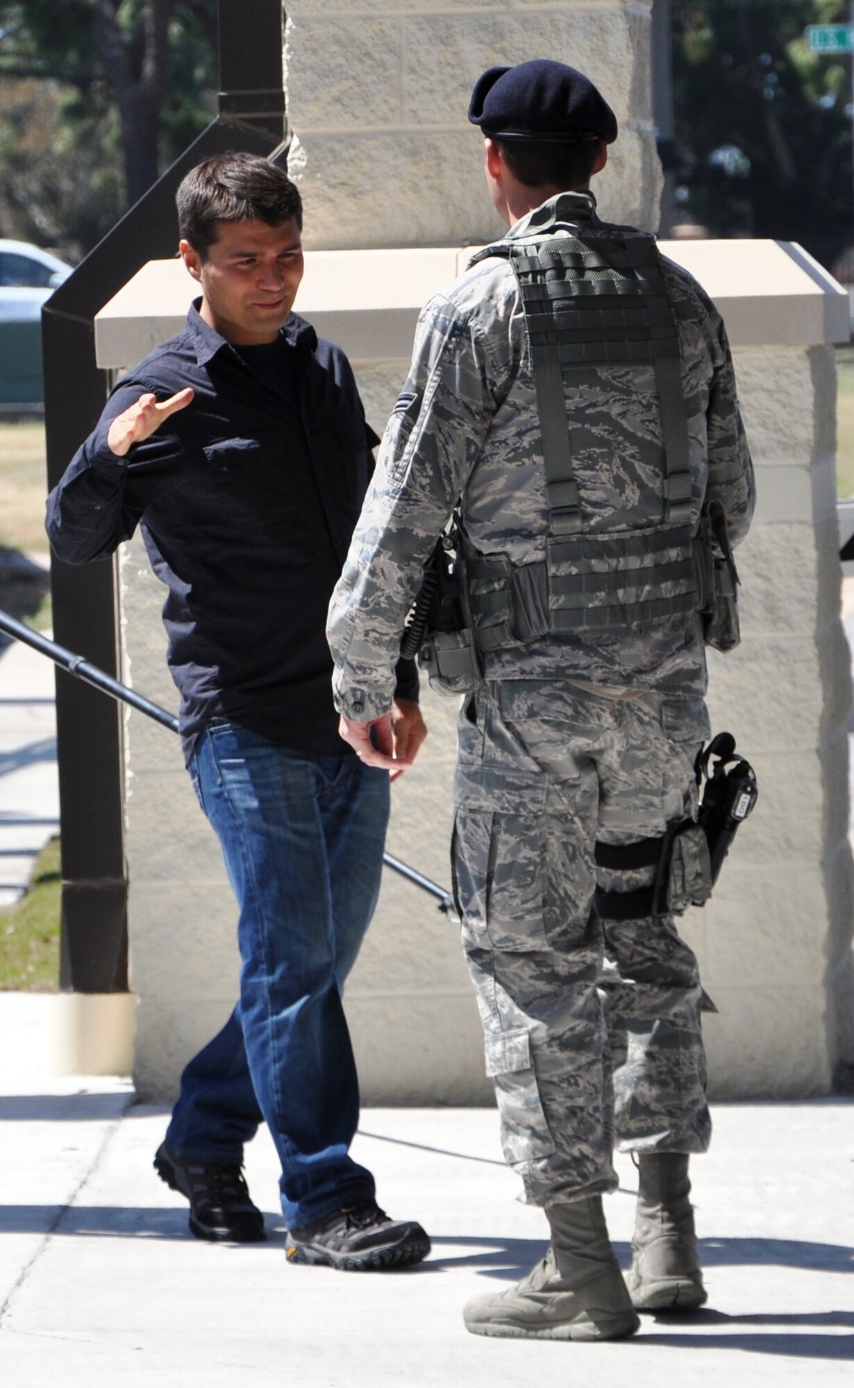 The Travel Channel’s street magician, JB Benn, greeting an Airman on March 29 at Tyndall Air Force Base. He and his crew were filming for their TV show “Magic Man,” which focuses on Mr. Benn stunning the average by stander on the street with his magic.