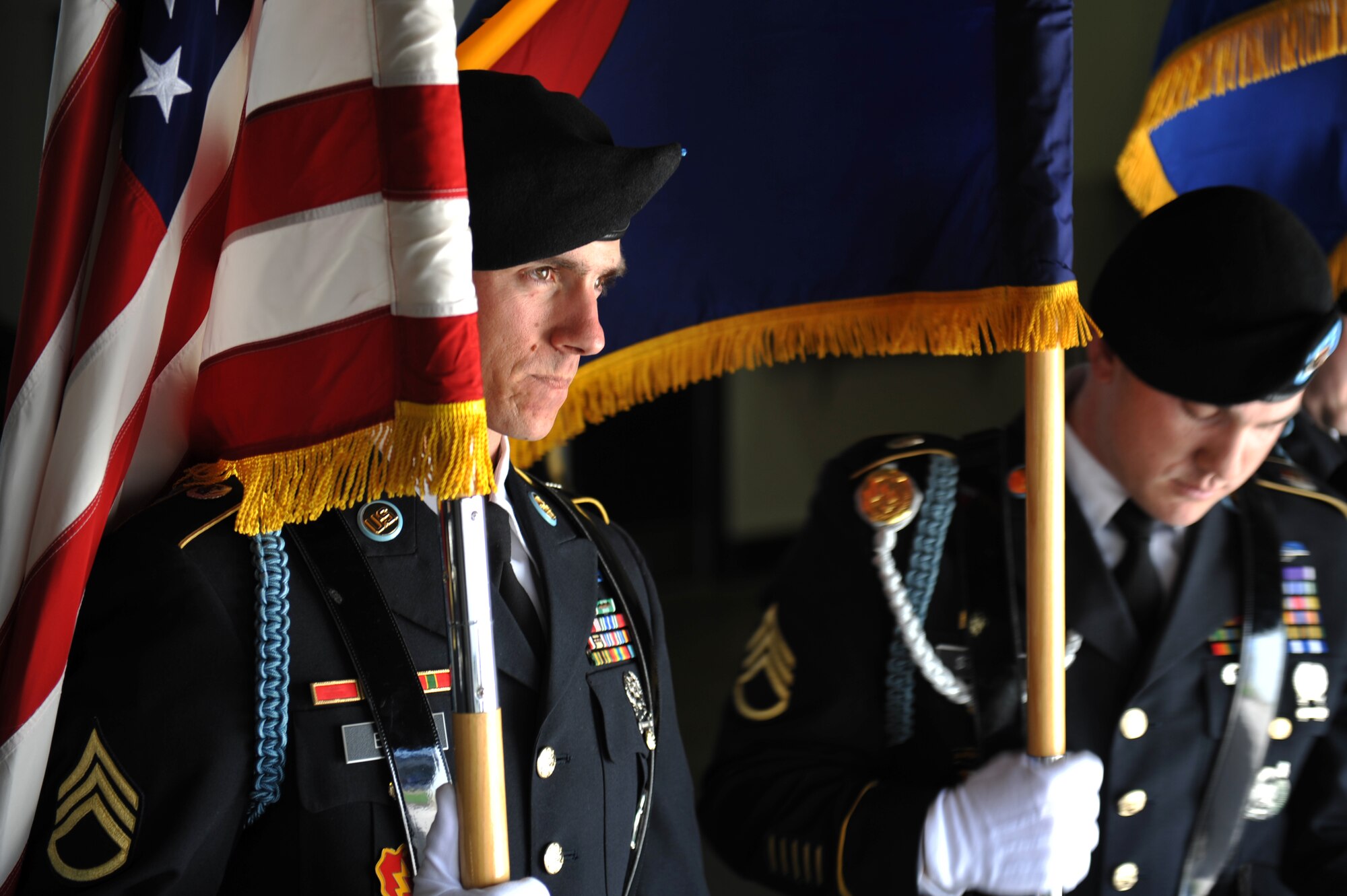 Army Staff Sgt. Justin Babb, Denver Recruiting Battalion, left, holds the American flag before the Colorado Rockies Opening Day April 5, 2013, at Coors Field, Denver. Service members from all U.S. military branches participated in the opening day ceremonies. (U.S. Air Force photo by Airman 1st Class Riley Johnson/Released)