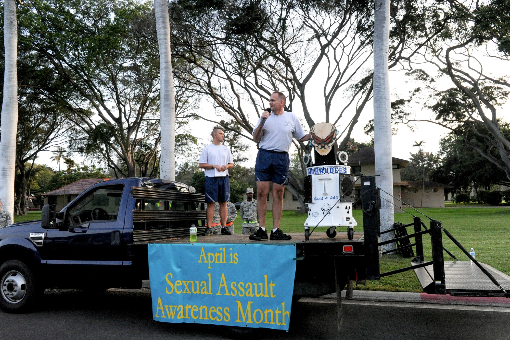 Col. Johnny Roscoe, 15th Wing commander, gives opening remarks at the monthly wing fun run at Joint Base Pearl Harbor-Hickam, Hawaii, April 5, 2013. In honor of Sexual Assault Awareness Month, the Air Force and Navy Sexual Assault Response Coordinators teamed up with their victim advocates to pass out informational brochures and other promotional items while cheering on the runners. (U.S. Air Force photo/Staff Sgt. Terri Paden)