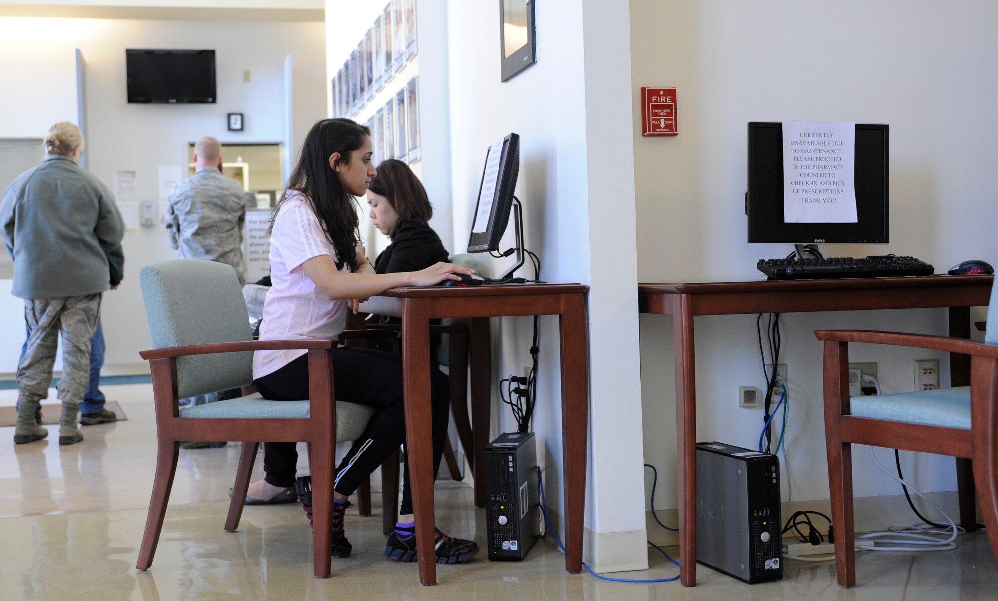 U.S. Air Force Airman Chloe Roze, 366th Comptroller Squadron customer service technician, sits at a pharmacy terminal, April 8, 2013, at Mountain Home Air Force Base, Idaho. The pharmacy is currently working on a more effective way to check-in patients. Slated for activation within the next few months, this computer-based system should streamline the patient check-in process. (U.S. Air Force photo by Airman 1st Class Shane M. Phipps/Released)