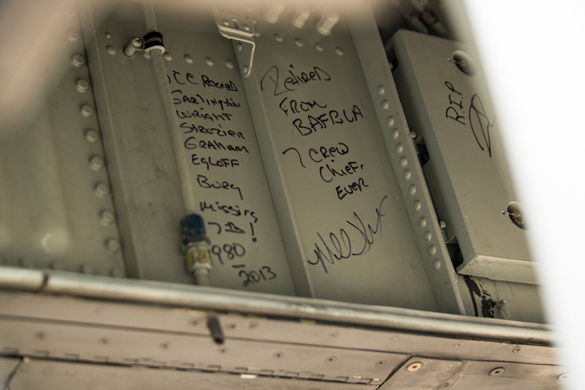 Names of past crew chiefs are written in the wheel well of a 917th Fighter Group A-10 Thunderbolt II prior to it leaving Barksdale Air Force Base, La., for Davis-Monthan AFB, Ariz., April 8, 2013. The aircraft will be retired from active service and is among the first three A-10s selected to leave Barksdale in preparation for the inactivation of the FG. (U.S. Air Force photo by Master Sgt. Greg Steele/Released)