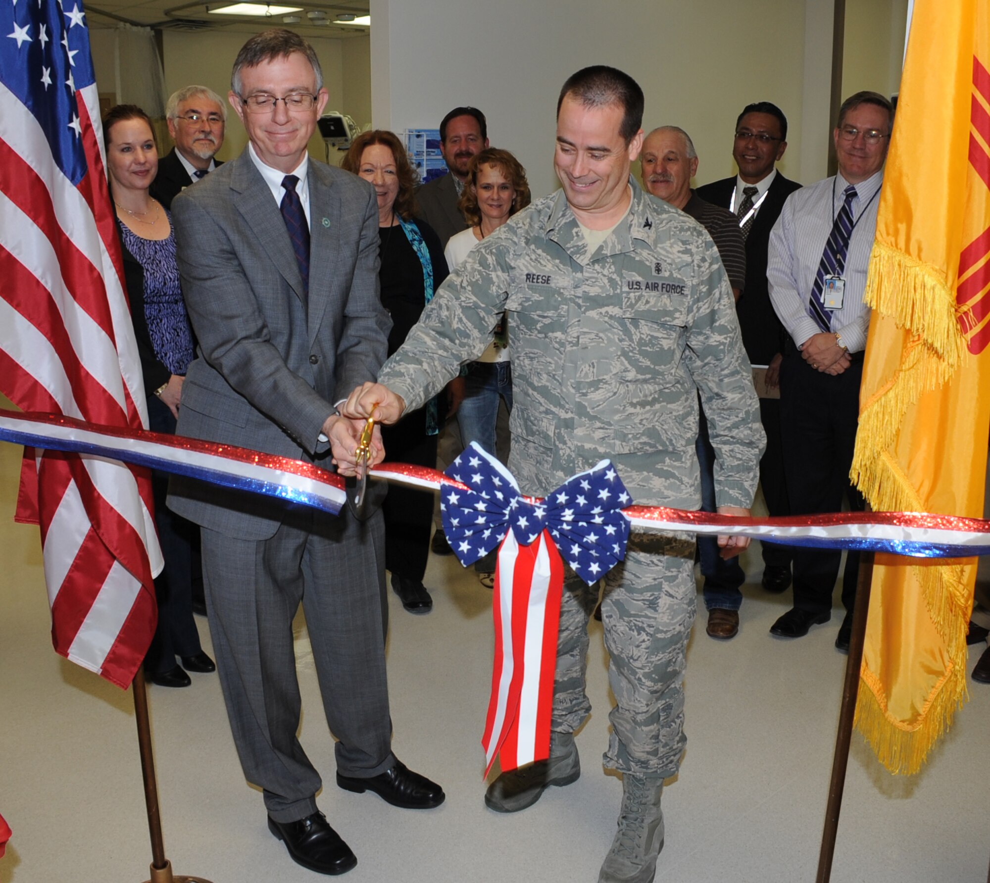 George Marnell, New Mexico Veterans Affairs Health Care System director, and Col. Steve Reese, 377th Medical Group commander, cut the ribbon on the new Same Day Surgery Unit.  The Air Force renovated and will maintain the facility, while the VA will staff the unit and treat 30 Air Force patients a month. (U.S. Air Force photo by Todd Berenger)