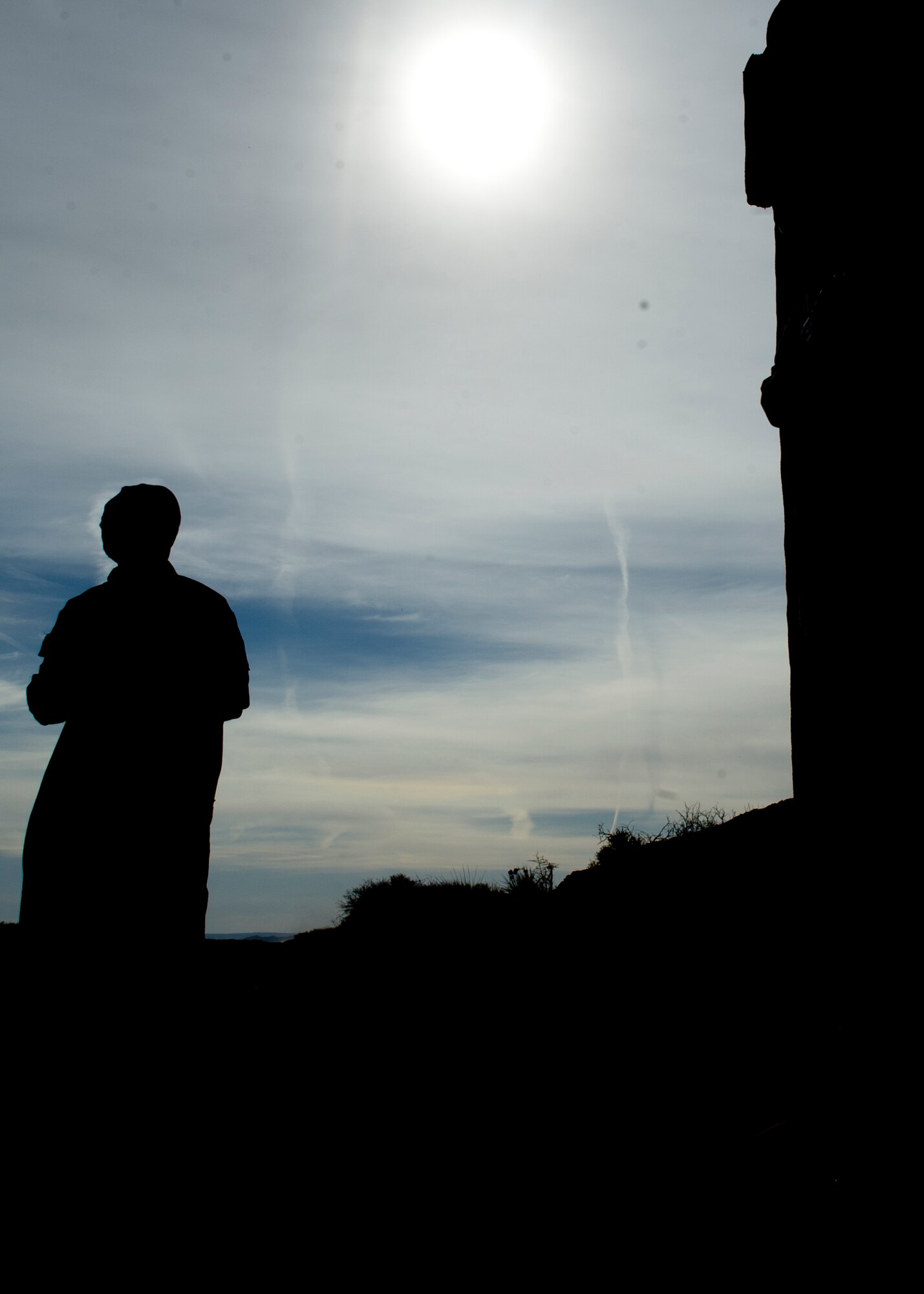 A Rally Point Management contractor acts as an opposing force during a simulated ground engagement during a Remotely Piloted Aircraft training scenario at White Sands Missile Range, N.M., April 5. Col. Andrew Croft, 49th Wing commander, and 49th Wing Command Chief Master Sgt. James Patrie were invited to participate in the Rally Point Management scenarios as the opposing force during an RPA training flight with students from Holloman Air Force Base, N.M. Rally Point Management trainers are experts on Joint Terminal Attack Controller (JTAC) and Close Air Support (CAS) procedures as well as ground warfighter equipment and software applications. The opportunity to be a part of the ground training scenarios helped 49th Wing leadership better understand RPA aircrews training experience here at Holloman AFB. (U.S. Air Force photo by Senior Airman DeAndre Curtiss/Released) 