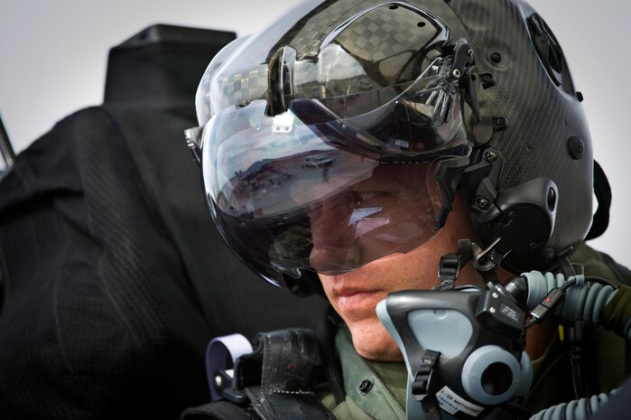 U.S. Air Force Capt. Brad Matherne, 422nd Test and Evaluation Squadron pilot, views flightline activity inside an F-35A Lightning II before a training mission April 4, 2013, at Nellis Air Force Base, Nev. The 422nd TES will design the tactics for the F-35A. The squadron will also determine how to integrate the F-35A with other aircraft in the Air Force inventory. (U.S. Air Force photo/Senior Airman Brett Clashman)