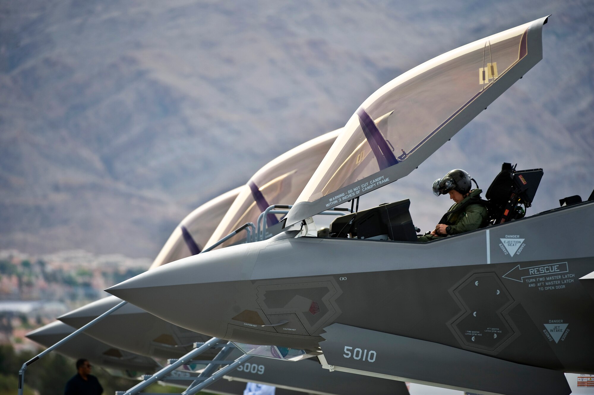 U.S. Air Force Capt. Brad Matherne, 422nd Test and Evaluation Squadron pilot, conducts pre-flight checks inside an F-35A Lightning II before a training mission April 4, 2013, at Nellis Air Force Base, Nev. The F-35A will be integrated into advanced training programs such as the USAF Weapons School, Red Flag and Green Flag exercises. (U.S. Air Force photo/Senior Airman Brett Clashman)
